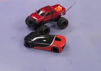 two remote controlled cars colliding